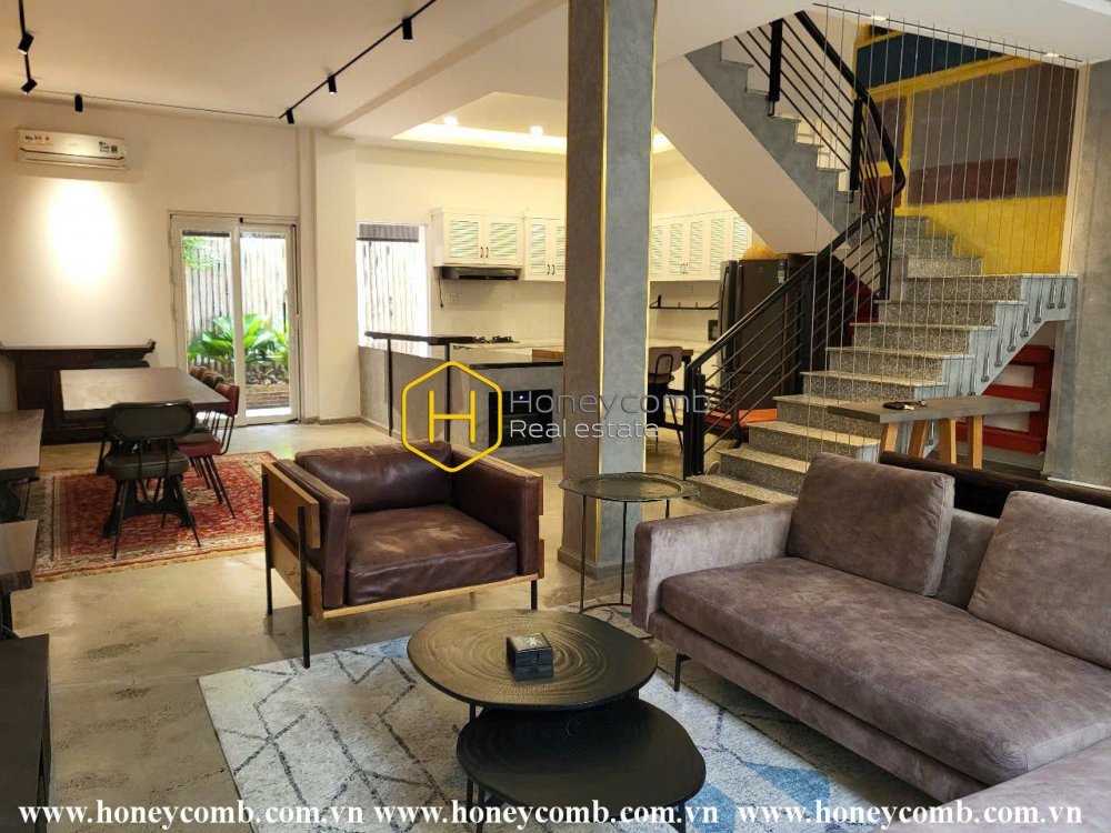 A stunning villa with bright layout and elegant wooden interiors for rent in Do Quang Street