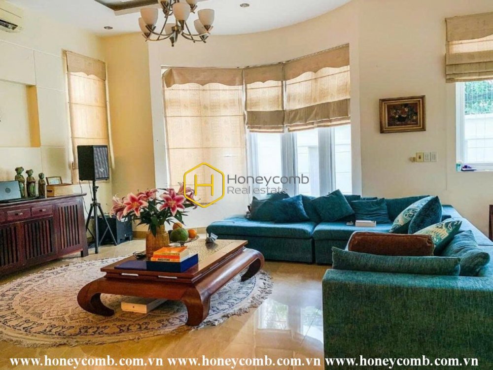 A rustic-designed villa featuring a refreshing swimming pool and a prime location on District 2